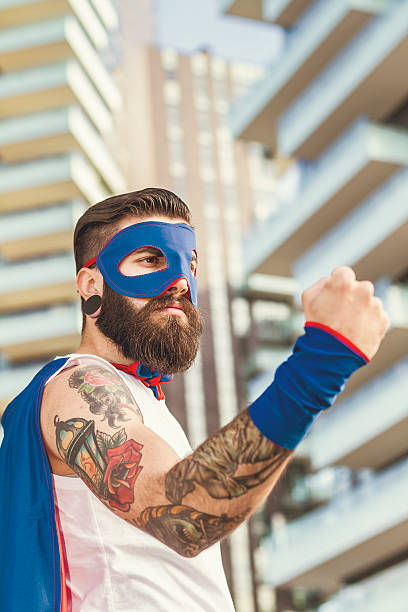 istock Hipster superhero showing fist 466476056