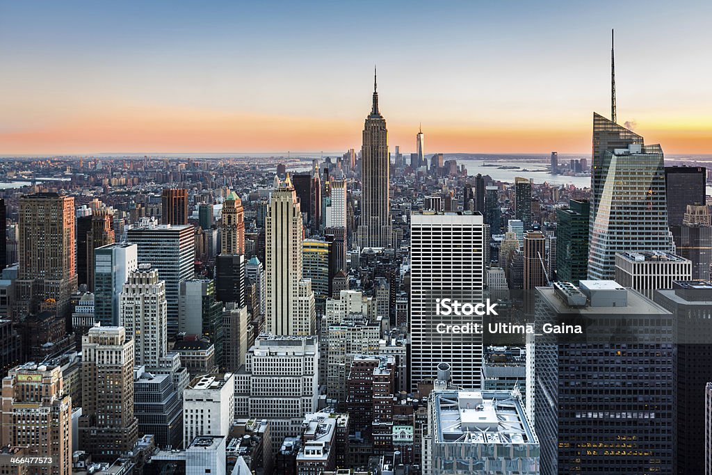 New York skyline at sunset New York City skyline with the Empire State Building and Bank of America tower (among other skyscrapers) at sunset. Empire State Building Stock Photo