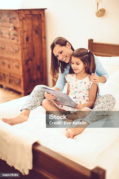 In The Bedroom Stock Photo - Download Image Now - Book, Child, Mother