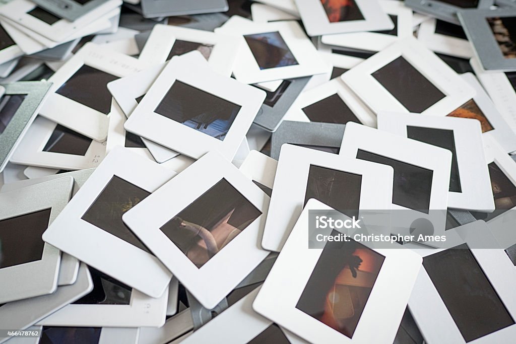 Pile of 35mm Film Slides A pile of 35mm colour film slides, close-up. My own images. Photographic Slide Stock Photo