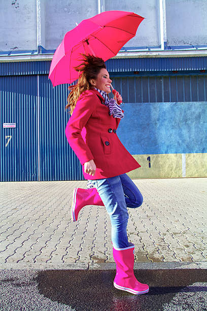 istock Woman with red umbrella 466479096