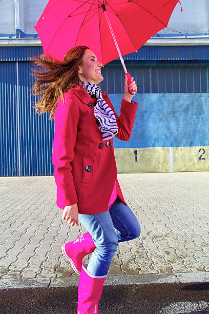 istock Woman with red umbrella 466479100