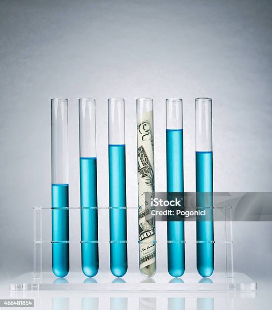 Research Costs Stock Photo - Download Image Now - Currency, Test Tube, Laboratory