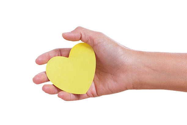 istock hand holding paper heart, 466482147