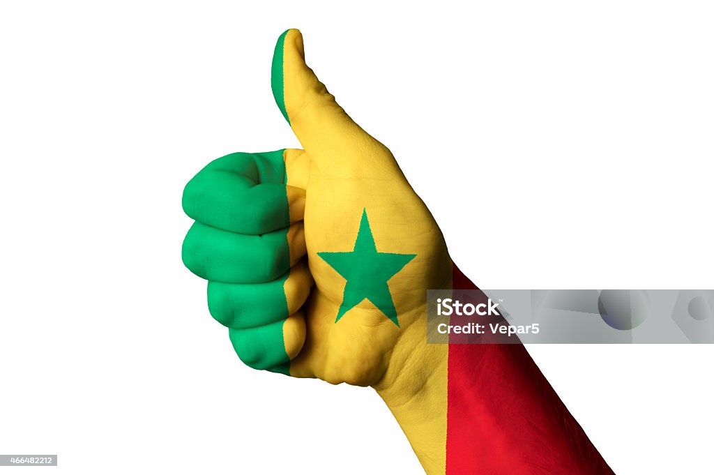 senegal national flag thumbs up gesture for excellence Hand with thumb up gesture in colored senegal national flag as symbol of excellence, achievement, good, - for tourism and touristic advertising, positive political, cultural, social management of country 2015 Stock Photo