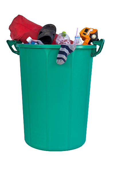 istock New big green plastic recycle bin filled with trash 466484935