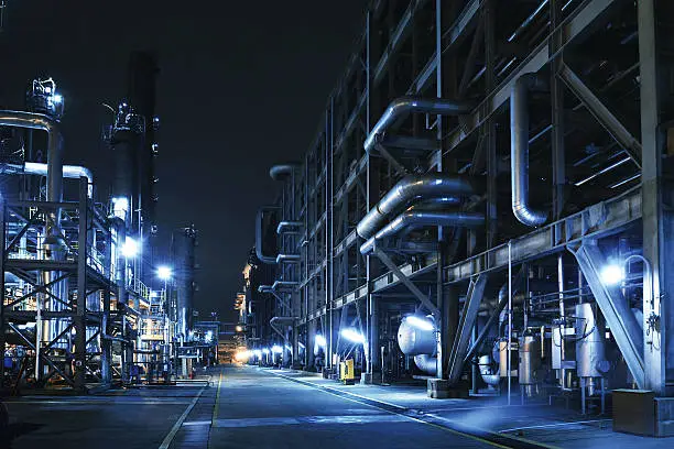 Oil Refinery, Chemical & Petrochemical plant abstract at night.