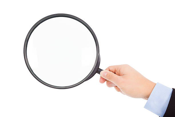 istock hand holding super  big magnifier glass 466486503