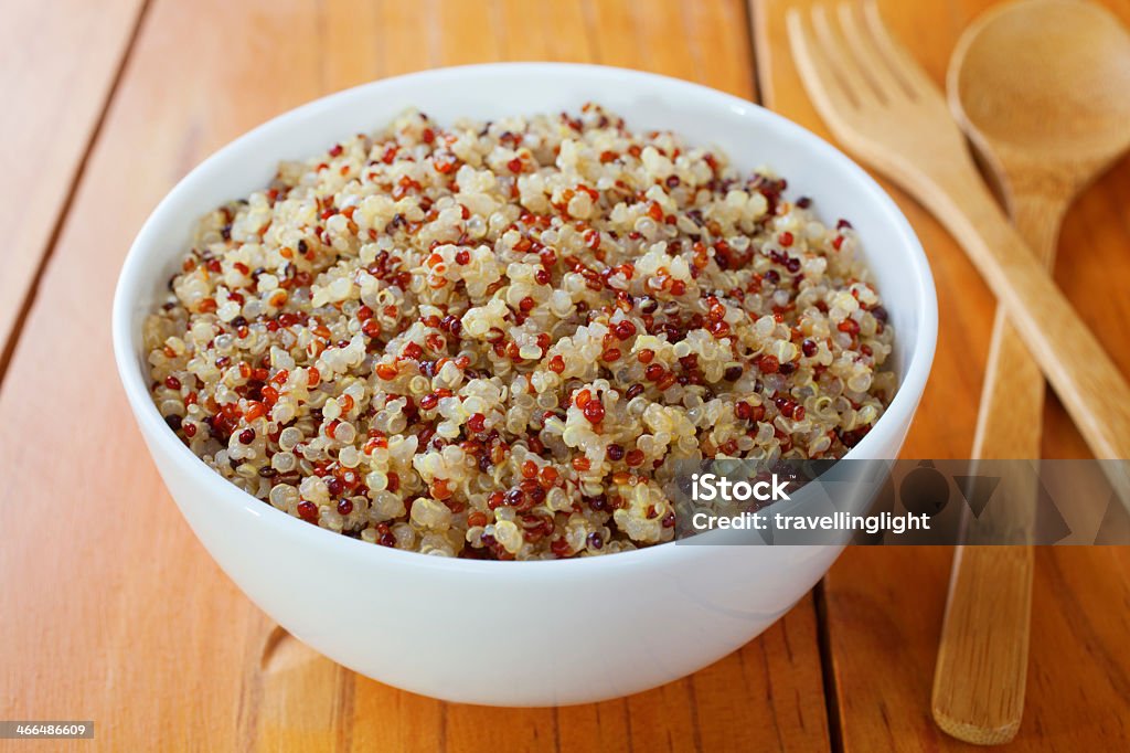 White bowl full of quinoa and amaranth Quinoa and Amaranth - a bowl of cooked quinoa and amaranth. Contains red, white and black quinoa. Amaranthus Stock Photo