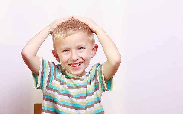 istock Surprised emotional blond boy child kid at the table 466488269