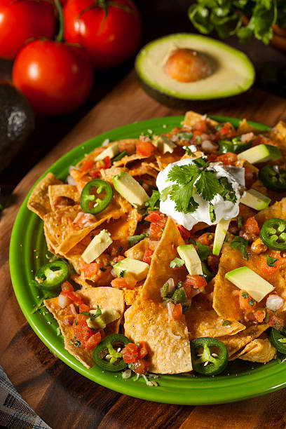 istock Homemade Unhealthy Nachos with Cheese and Vegetables 466488613