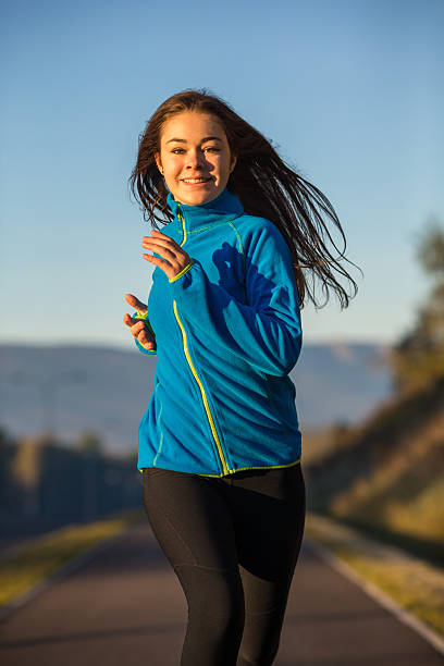istock Young woman running 466491050