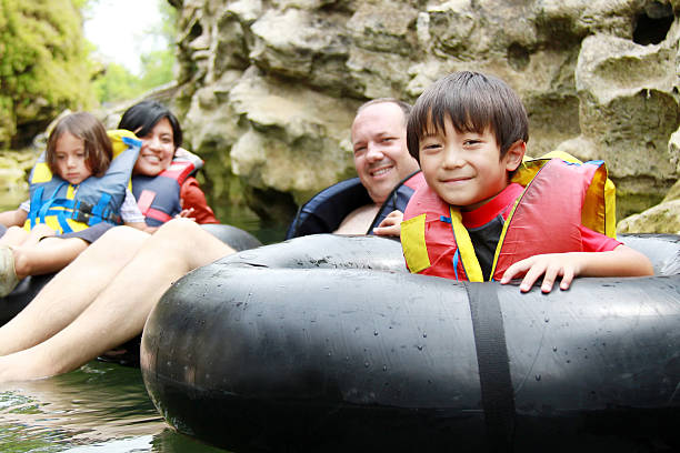 istock family on inflatable tube 466491224