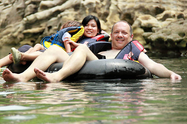 istock family on inflatable tube 466491226