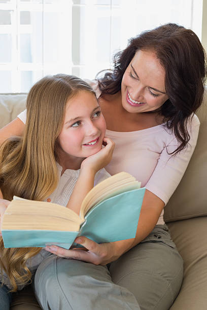 istock Mother and daughter with story book 466496580