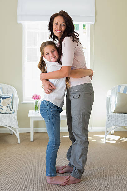 istock Happy mother and daughter embracing 466496610