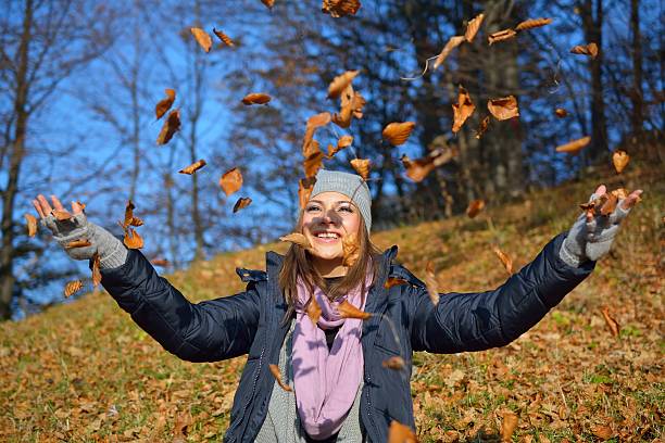 istock Beautiful girl drop up leaves 466497166