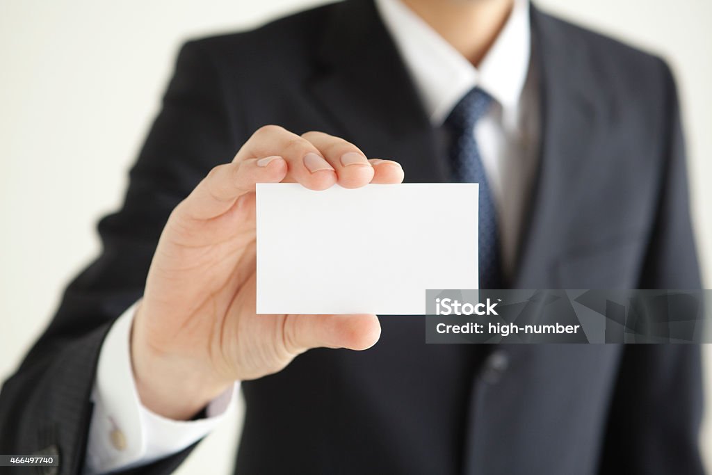 Hand of business man with a card Businessman's hand with card 2015 Stock Photo