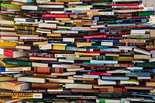 Education concept. Campus. Stack of books as buildings on a street. Books avenue. 3d illustration.