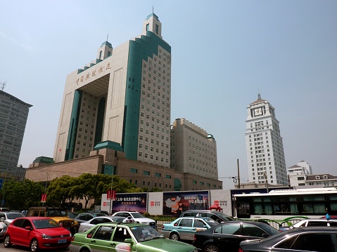 Shanghai, China - May 8, 2014: Traffic jam on Mingsheng road under the imposing Shanghai Entry-Exit Inspection and Quarantine Bureau building in Pudong