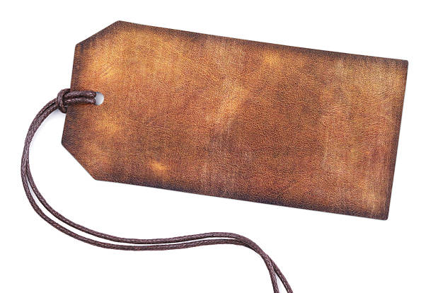 Blank brown leather tag Blank brown leather tag isolated on white background old luggage tag stock pictures, royalty-free photos & images