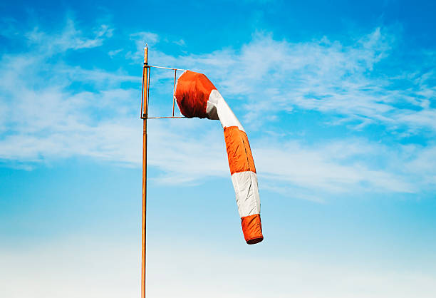 There is no wind Wind sock down in no wind against on blue sky. gauge photos stock pictures, royalty-free photos & images