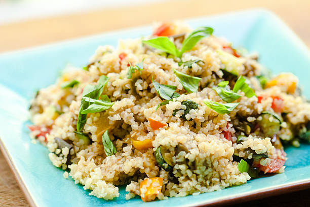 istock Bulgur Salad With Zucchini, tomatoes and Fresh Basil 466499115