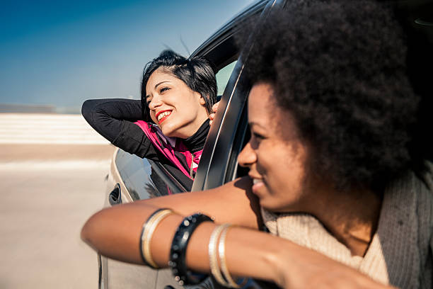 istock Women friends enjoying vacations during a road trip 466500236