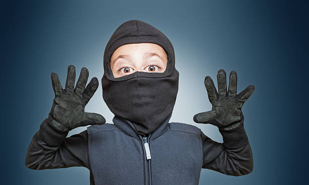 istock Surprised comic burglar stopped and take his hands up 466500368