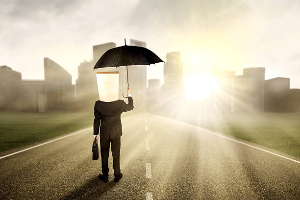 istock Worker with a carton head on the road 466500850