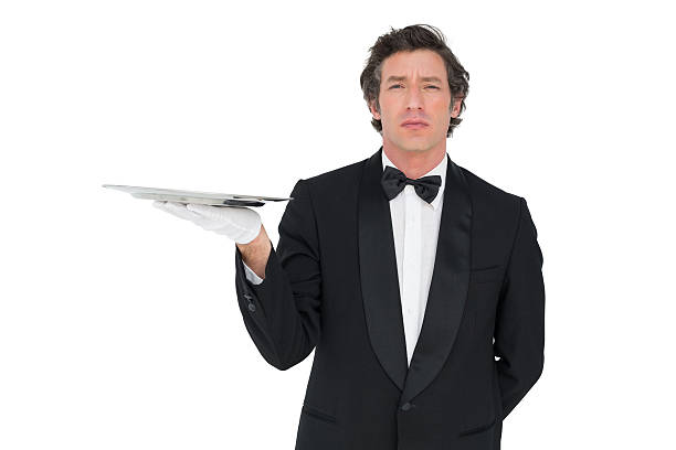 istock Server with attitude holding tray against white background 466501240
