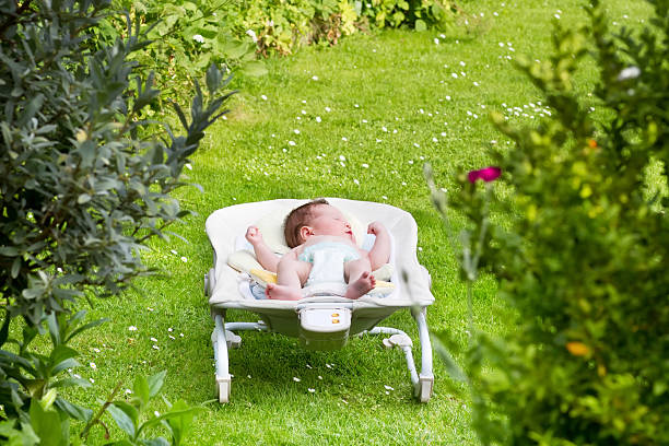 istock Newborn baby sleeping in the garden 466502769