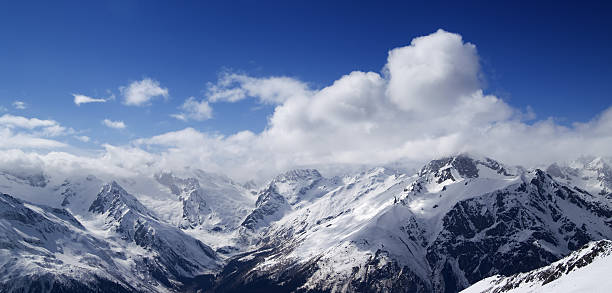 istock Panorama of Caucasus Mountains in sunny clouds 466503297