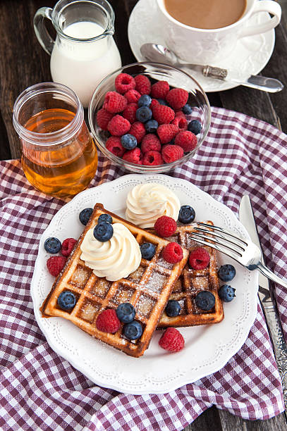 istock Belgian waffles with whipped cream and fresh berries 466503929
