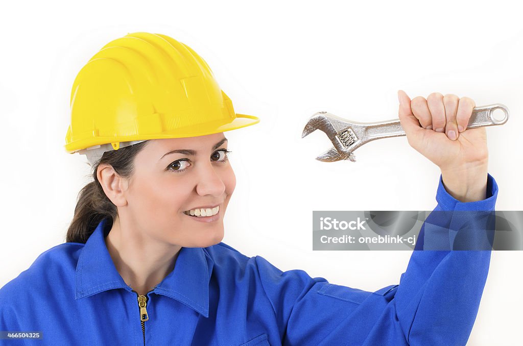 Woman holding Adjustable Wrench Woman wearing protective equipment holding adjustable wrench Adjustable Stock Photo