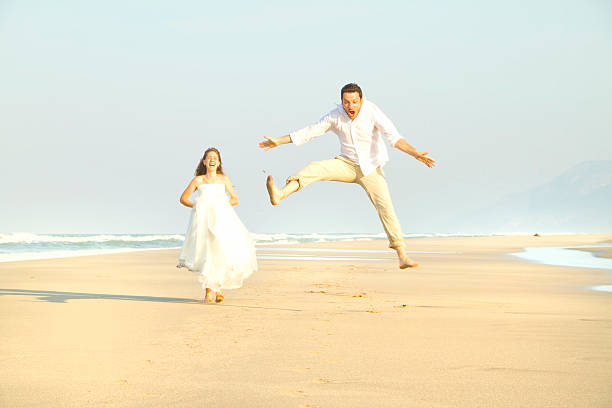 istock happy couple at beach 466504914