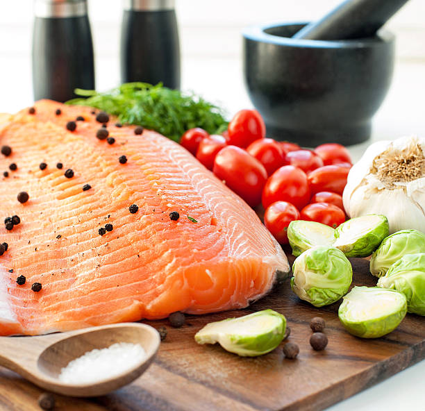 istock Fresh salmon with vegetables - ready to eat, ready to cook. 466505270