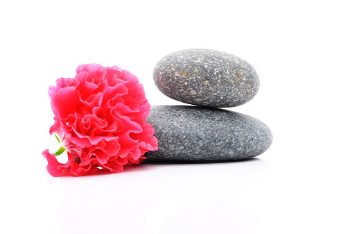 The Zen And Spa Stone with Hibiscus Flower Over White Background