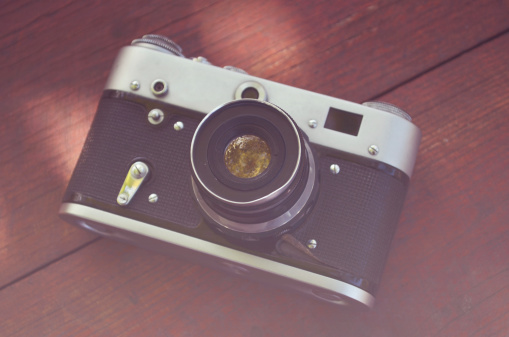 Vintage camera on wooden background