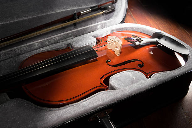 istock Wooden violin in black case. 466506392