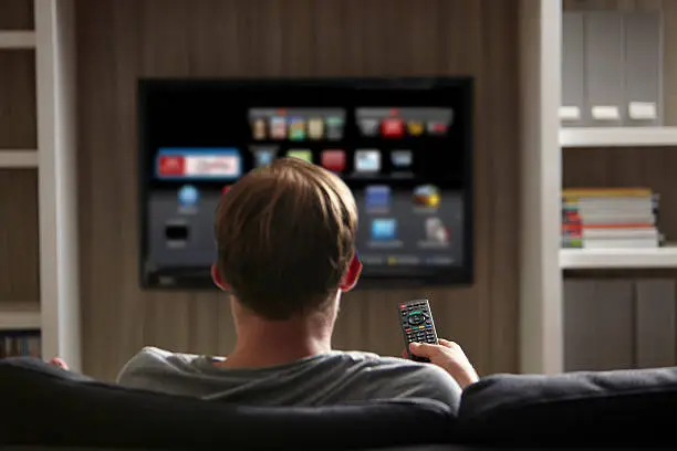 Photo of Man watching TV