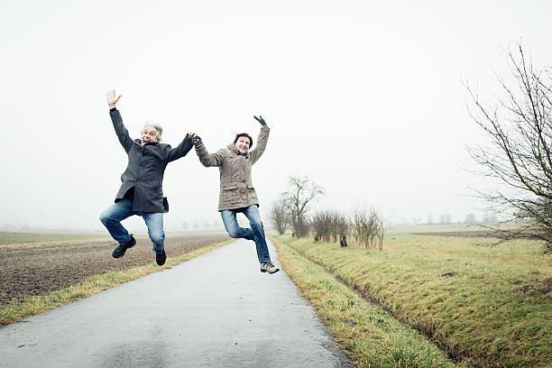 istock senior couple jumping 466507825