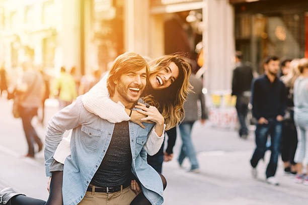 istock Young man carrying his girlfriend at piggyback 466509616