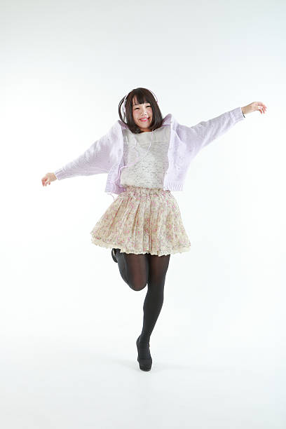 istock Female jumping while listening to music 466510004