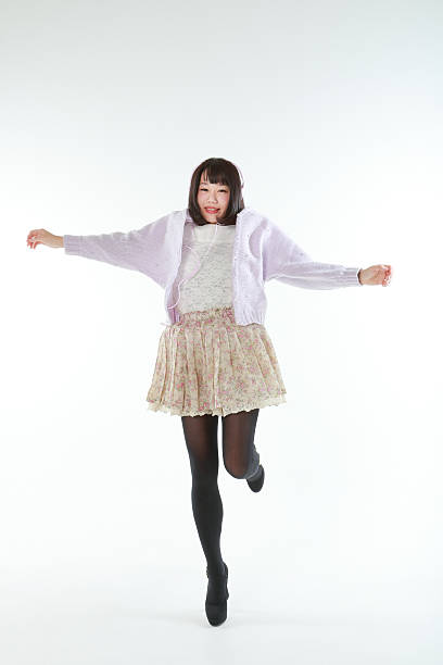 istock Female jumping while listening to music 466510006