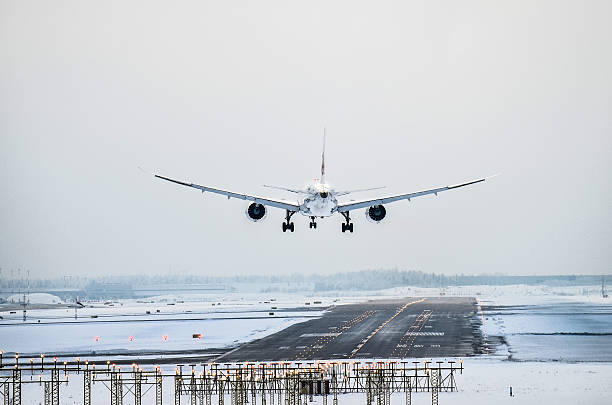istock Airplane landing to runway in winter 466510042