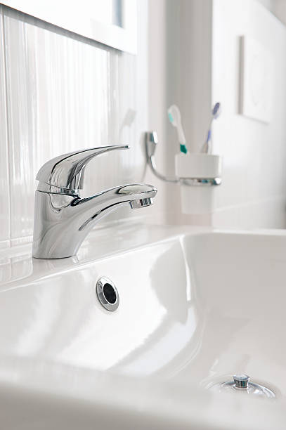 istock Steel faucet in a bathroom 466512494