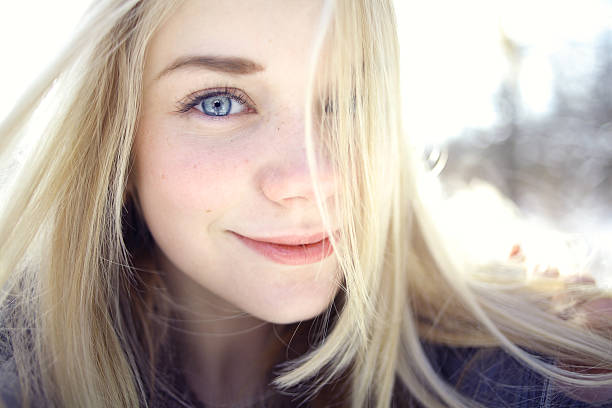 beautiful young girl in a field of flowers
