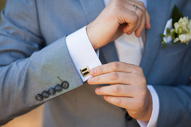 Groom getting ready for the wedding Groom getting ready for the wedding. unrecognizable man. cufflink stock pictures, royalty-free photos & images