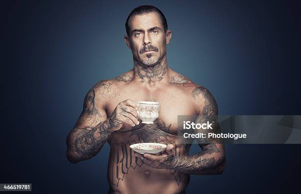 Bare Chested Man With Tattoos Holding A Cup Of Tea Stock Photo - Download Image Now
